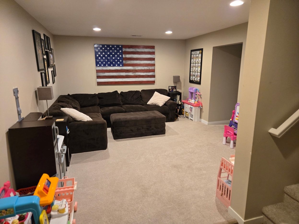 Finished basement at 934 2nd Street Jesup Iowa - sectional and open rec space