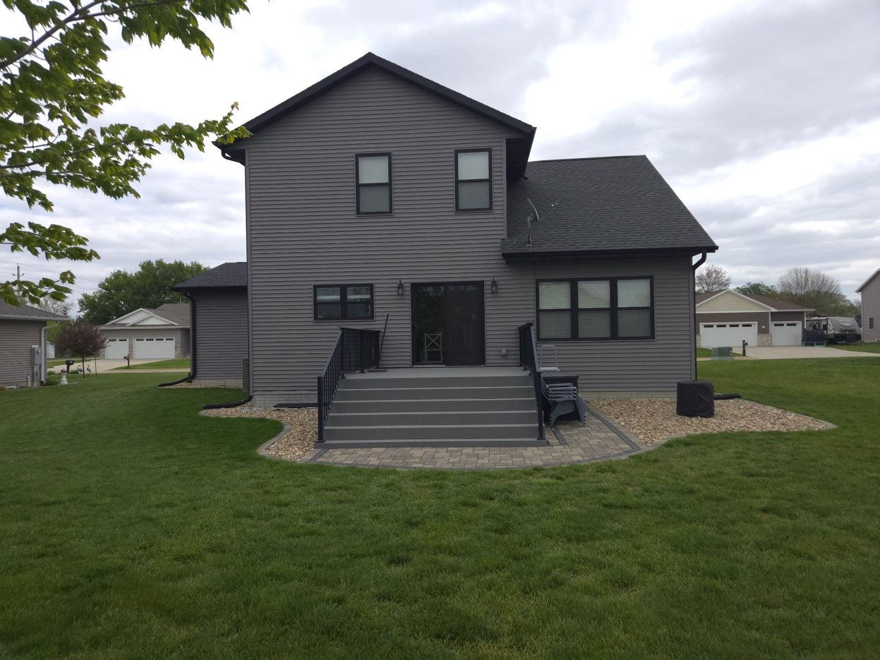 Rear of 934 2nd Street Jesup Iowa - composite deck with patio area