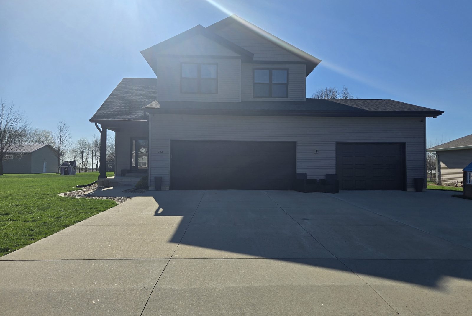 Exterior front view of 934 2nd Street Jesup Iowa - 2017 built home with 3-car garage and covered front porch